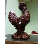 A CONTINENTAL MAJOLICA MODEL OF A COCKEREL AND ANOTHER WITH BROWN GLAZE. 59cms & 48cms (2)