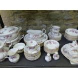 A ROYAL ALBERT BONE CHINA LAVENDER ROSE PATTERN PART DINNER AND TEA SERVICE FOR EIGHT PLACE