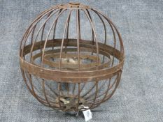 AN UNUSUAL WROUGHT IRON HANGING CIRCULAR CAGE FORM GIMBALLED MARINE OIL LAMP. DIA.46cms.