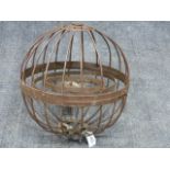 AN UNUSUAL WROUGHT IRON HANGING CIRCULAR CAGE FORM GIMBALLED MARINE OIL LAMP. DIA.46cms.