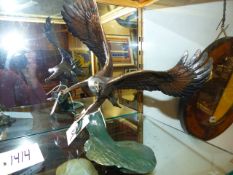 20th/21st.C. SCHOOL. AN EAGLE CLUTCHING A SALMON, A FINELY CAST COLD PAINTED BRONZE SIGNED
