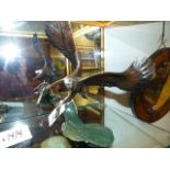 20th/21st.C. SCHOOL. AN EAGLE CLUTCHING A SALMON, A FINELY CAST COLD PAINTED BRONZE SIGNED