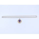 AN 18ct GOLD STAMPED LARGE PURPLE SAPPHIRE PENDANT SUSPENDED ON A 9ct GOLD ROPE NECKLACE, LENGTH