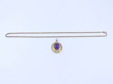 AN 18ct GOLD STAMPED LARGE PURPLE SAPPHIRE PENDANT SUSPENDED ON A 9ct GOLD ROPE NECKLACE, LENGTH