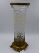 AN ORMOLU MOUNTED FRENCH STYLE CUT CRYSTAL CYLINDER FORM VASE ON CIRCULAR BASE WITH PAW FEET. H.