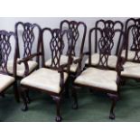 A SET OF EIGHT CARVED MAHOGANY DINING CHAIRS IN THE CHIPPENDALE TASTE TO INCLUDE TWO ARMCHAIRS.