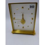 A JAEGER LE COULTRE ANODISED BRASS CASED DESK CLOCK WITH VISIBLE SKELETON TYPE MOVEMENT, NUMBERED