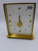 A JAEGER LE COULTRE ANODISED BRASS CASED DESK CLOCK WITH VISIBLE SKELETON TYPE MOVEMENT, NUMBERED