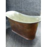 A VINTAGE COPPER OVAL DEEP BATHTUB WITH FITMENTS AND TINNED INTERIOR. H.78, D.63, W.152cms.