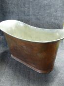 A VINTAGE COPPER OVAL DEEP BATHTUB WITH FITMENTS AND TINNED INTERIOR. H.78, D.63, W.152cms.