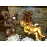 THREE ANTIQUE AND LATER FIGURES OF CHERUBS AND CUPIDS, ONE PLAYING A LYRE. H.29cms. (3)