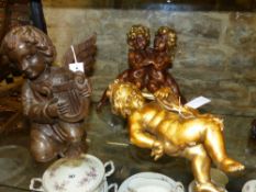 THREE ANTIQUE AND LATER FIGURES OF CHERUBS AND CUPIDS, ONE PLAYING A LYRE. H.29cms. (3)