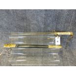 A GEORGE V NAVAL MIDSHIPMAN'S DIRK WITH ETCHED BLADE BY GIEVES COMPLETE WITH SCABBARD BEARING OWNERS