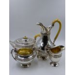 A SILVER FOUR PIECE TEASET COMPRISING A TEAPOT, HOT WATER POT, TWO HANDLED SUCRIER AND CREAM JUG.