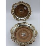 A VICTORIAN PAIR OF SILVER WINE COASTERS WITH FLUTED RIMS, SHEFFIELD 1846. DIA.18cms.