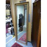 AN ANTIQUE GILT FRENCH STYLE PIER MIRROR. 164 x 58cms.