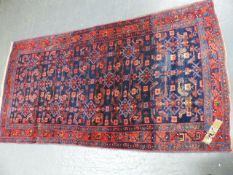 A PERSIAN HAMADAN RUG. 242 x 124cms