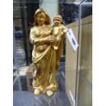 AN EARLY CARVED GILTWOOD STANDING FIGURE OF THE MADONNA AND CHILD. H.32cms.