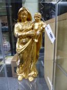 AN EARLY CARVED GILTWOOD STANDING FIGURE OF THE MADONNA AND CHILD. H.32cms.