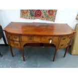 A REGENCY INLAID MAHOGANY BOW FRONT SIDEBOARD WITH CENTRE DRAWER ABOVE TAMBOUR DOORS FLANKED BY DEEP
