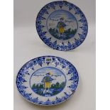 A PAIR OF ANTIQUE FAIENCE POTTERY PLATES DECORATED WITH HAND PAINTED FIGURES LECAPITANT SPERVA