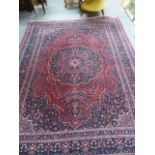 AN ANTIQUE PERSIAN CARPET OF CLASSICAL DESIGN. 336 x 250cms.