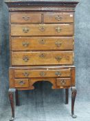 A LATE GEORGIAN OAK CHEST ON STAND WITH CONFIGURATION OF BLIND FRIEZE DRAWER OVER TWO SHORT, THREE