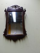 A GEORGIAN MAHOGANY FRET MIRROR WITH PIERCED PHOENIX BIRD CREST. H.72cms.