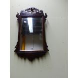 A GEORGIAN MAHOGANY FRET MIRROR WITH PIERCED PHOENIX BIRD CREST. H.72cms.