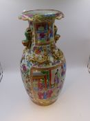 A CHINESE CANTONESE BALUSTER VASE WITH FOO LION HANDLES AND PANELS OF FIGURES, GILT SALAMANDERS TO