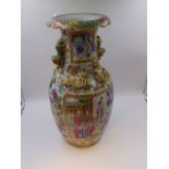 A CHINESE CANTONESE BALUSTER VASE WITH FOO LION HANDLES AND PANELS OF FIGURES, GILT SALAMANDERS TO