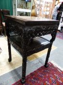 AN ANTIQUE CHINESE MARBLE TOP CARVED HARDWOOD STAND, UNDERTIER WITH TWO APRON DRAWERS.