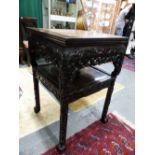 AN ANTIQUE CHINESE MARBLE TOP CARVED HARDWOOD STAND, UNDERTIER WITH TWO APRON DRAWERS.