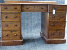 A VICTORIAN MAHOGANY TWIN PEDESTAL DESK, SHAPED TOP WITH THREE APRON DRAWERS, EACH PEDESTAL WITH