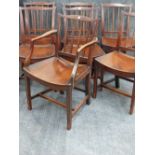 A GOOD SET OF SEVEN GEORGIAN COUNTRY OAK DINING CHAIRS WITH SHAPED PANEL SEATS.