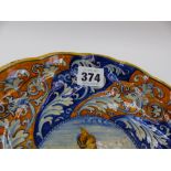 AN ITALIAN MAJOLICA TAZZA WITH WHORL DECORATION AND CENTRE PORTRAIT. DIA. 23cms x H.5cms TOGETHER