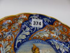 AN ITALIAN MAJOLICA TAZZA WITH WHORL DECORATION AND CENTRE PORTRAIT. DIA. 23cms x H.5cms TOGETHER