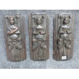 A SET OF THREE EARLY CARVED OAK ELEMENTS. H.33cms.