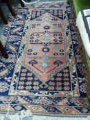 A TURKISH BERGAMA DESIGN RUG 196 x 130cms TOGETHER WITH AN ANTIQUE CHINESE RUG.