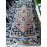 A TURKISH BERGAMA DESIGN RUG 196 x 130cms TOGETHER WITH AN ANTIQUE CHINESE RUG.