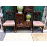 A PAIR OF ANTIQUE CONTINENTAL CARVED NEO CLASSIC STYLE CHAIRS WITH PIERCED SHIELD FORM BACK SPLATS.