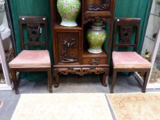 A PAIR OF ANTIQUE CONTINENTAL CARVED NEO CLASSIC STYLE CHAIRS WITH PIERCED SHIELD FORM BACK SPLATS.
