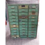 AN UNUSUAL VINTAGE GREEN PAINTED STEEL FRAMED MULTI DRAWER CABINET WITH THIRTY THREE SHORT