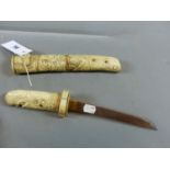 A JAPANESE TANTO IN CARVED IVORY AND BONE SCABBARD WITH DRAGON HEAD GRIP