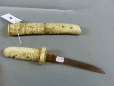 A JAPANESE TANTO IN CARVED IVORY AND BONE SCABBARD WITH DRAGON HEAD GRIP