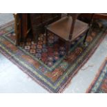 A PAIR OF ANTIQUE PERSIAN RUGS OF CAUCASIAN DESIGN. 170x112cms.