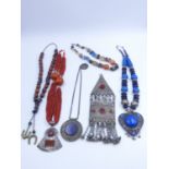 SIX PIECES OF VARIOUS NORTH AFRICAN TRIBAL JEWELLERY.