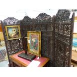 AN ANTIQUE INDIAN CARVED HARDWOOD FOUR FOLD FLOOR SCREEN WITH ELABORATE PIERCED GRAPE VINE