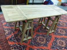 AN UNUSUAL EARLY 20th.C.PALE OAK ADJUSTABLE ARTIST'S TABLE WITH DROP LEAVES AND TRESTLE END