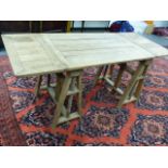AN UNUSUAL EARLY 20th.C.PALE OAK ADJUSTABLE ARTIST'S TABLE WITH DROP LEAVES AND TRESTLE END